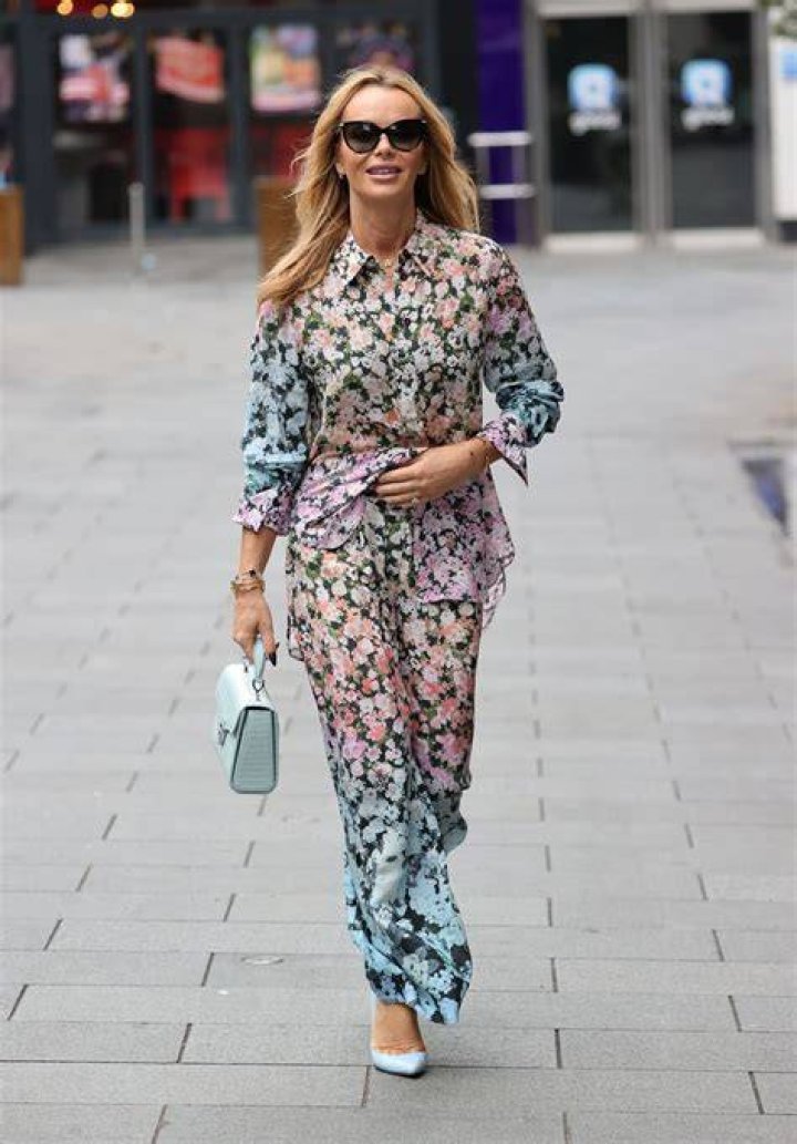 Amanda Holden wearing a floral mini dress and white stilettos 