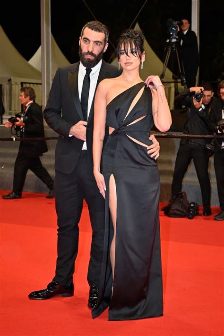 Dua Lipa and Romain Gavras attend the "Omar La Fraise (The King of Algiers)" red carpet during the 76th annual Cannes film festival at Palais des Festivals on May 19, 2023 in Cannes, France.