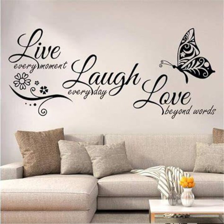 Having a laugh: The wall above the yellow velvet sofa was decorate with several humorous paintings