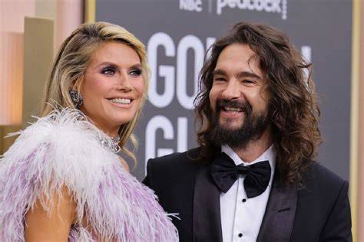 Heidi and Tom Kaulitz smiling at the Oscars 2023