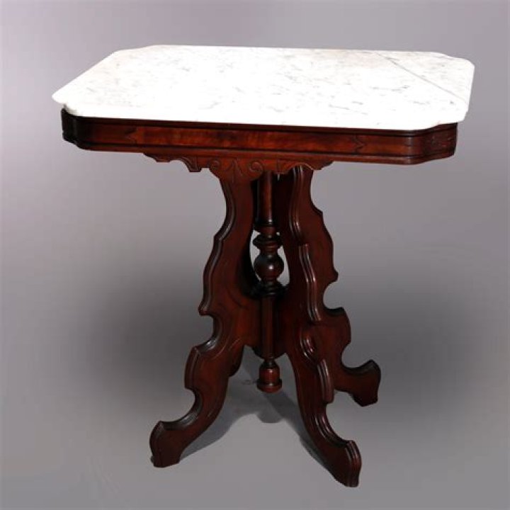 Old school: The small marble end table between the seats was topped off with a retro lamp with a fringed shade