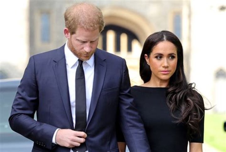 prince harry with meghan markle holding archie