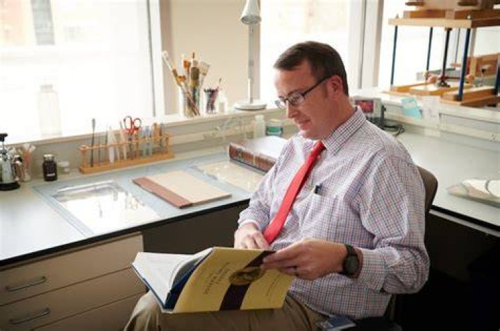 Robin Jensen holds a volume of the Joseph Smith Papers.