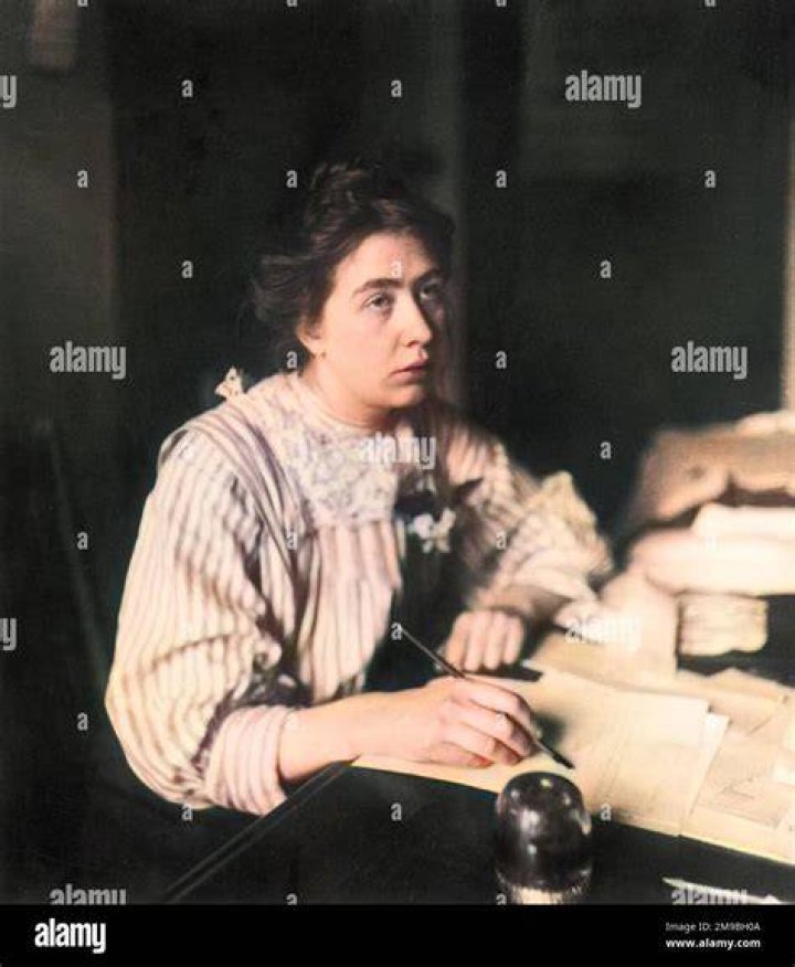 Sylvia Pankhurst sitting with her hand under her chin